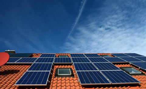solar panels on a rust orange roof