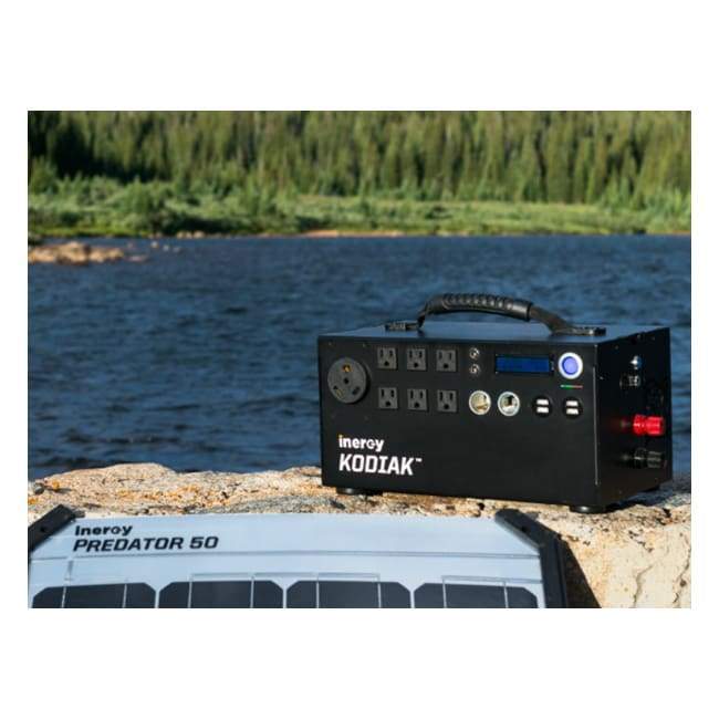 Kodiak Solar Generator by Inergy sitting on rock by lake - Shop Solar Kits