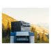 Kodiak Solar Generator by Inergy sitting on machine with mountains in background - Shop Solar Kits