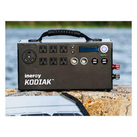 Kodiak Solar Generator by Inergy sitting on rock by water - Shop Solar Kits